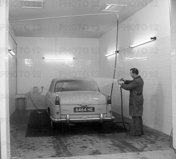 A 1961 Austin Westminster in a car wash, Grimsby, 1965.  Artist: Michael Walters