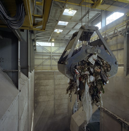 Waste ready for incineration in giant crane grab jaws, St Helier, Jersey, 1980.  Artist: Michael Walters