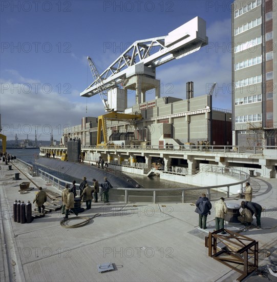 A nuclear submarine berthing at Devonport docks, Plymouth, Devon, 1980. Artist: Michael Walters