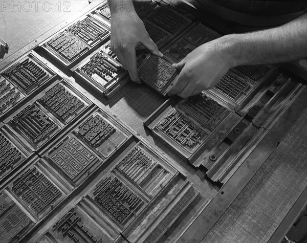 Linotype block being set in the dye at a printworks, Mexborough, South Yorkshire, 1959. Artist: Michael Walters