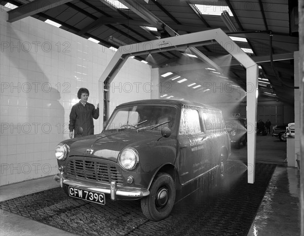 Mini van being washed in a car wash, Co-op garage, Scunthorpe, Lincolnshire, 1965.  Artist: Michael Walters