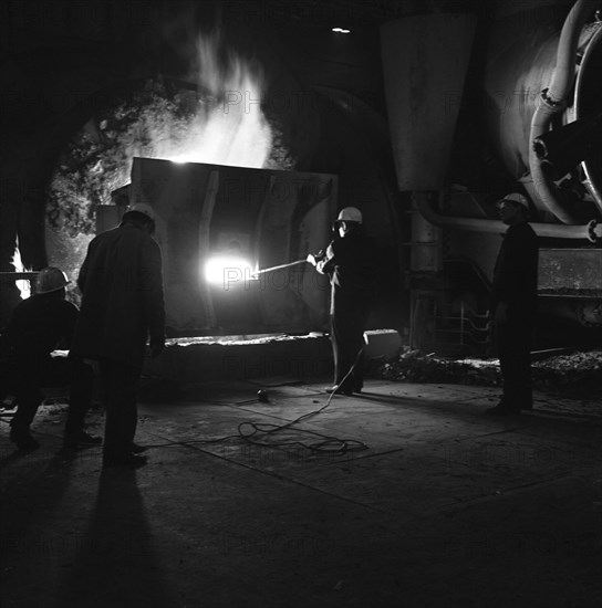 Testing temperature of molten steel, Park Gate Iron & Steel Co, Rotherham, South Yorkshire, 1964. Artist: Michael Walters