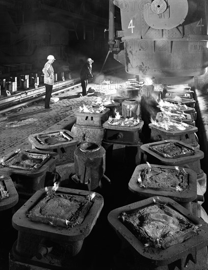 Pig casting at the Park Gate Iron & Steel Co, Rotherham, South Yorkshire, 1964. Artist: Michael Walters