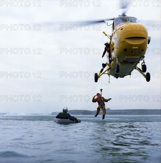 Westland Whirlwind helicopter making a rescue, 1973. Artist: Michael Walters