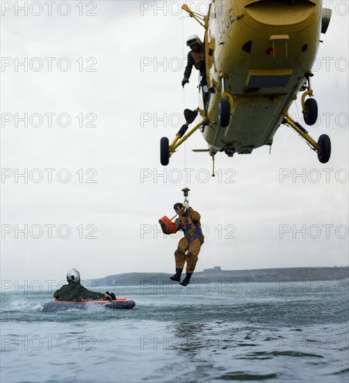 Westland Whirlwind helicopter making a rescue, 1973. Artist: Michael Walters