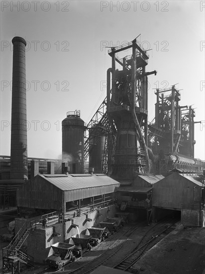Molten steel being poured into rail trucks at the Stanton Steelworks, Ilkeston, Derbyshire, 1962. Artist: Michael Walters