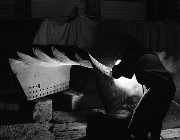 Welding a dragline bucket, Edgar Allen Steel Co, Sheffield, South Yorkshire, 1962. Artist: Michael Walters