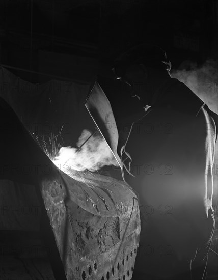 Welding a dragline bucket, Edgar Allen Steel Co, Sheffield, South Yorkshire, 1962. Artist: Michael Walters