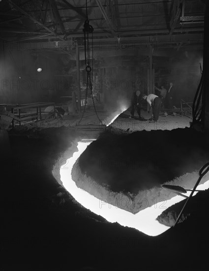 Molten steel being channelled at the Stanton Steel Works, Ilkeston, Derbyshire, 1962.  Artist: Michael Walters