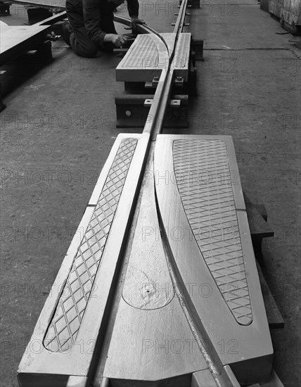 A trackwork junction being installed in a Sheffield factory, South Yorkshire, 1963. Artist: Michael Walters