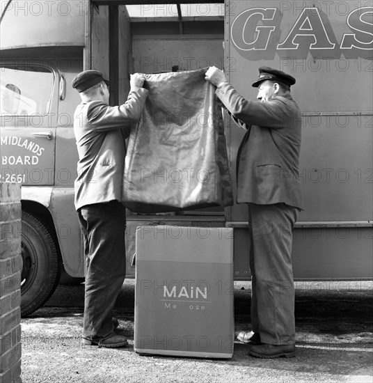 Home delivery of a cooker, Darfield, Barnsley, South Yorkshire, 1963. Artist: Michael Walters