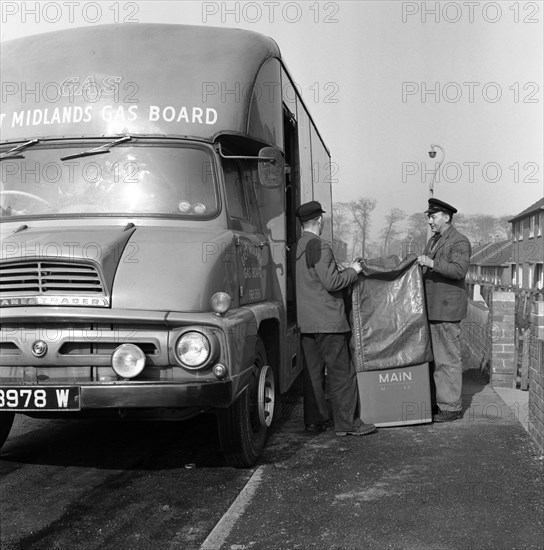 Home delivery of a cooker, Darfield, Barnsley, South Yorkshire, 1963. Artist: Michael Walters