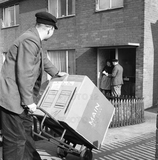 Home delivery of a cooker, Darfield, Barnsley, South Yorkshire, 1963. Artist: Michael Walters