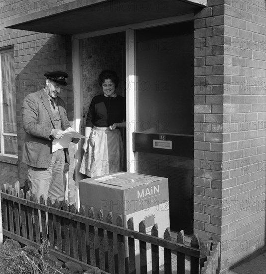 Home delivery of a cooker, Darfield, Barnsley, South Yorkshire, 1963. Artist: Michael Walters