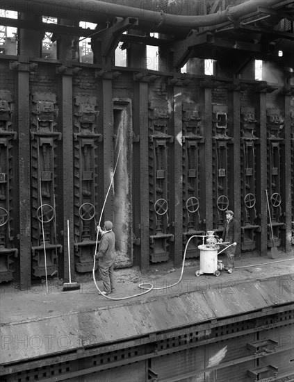 Spraying refractory linings at Manvers coking works, near Rotherham, South Yorkshire, 1963. Artist: Michael Walters