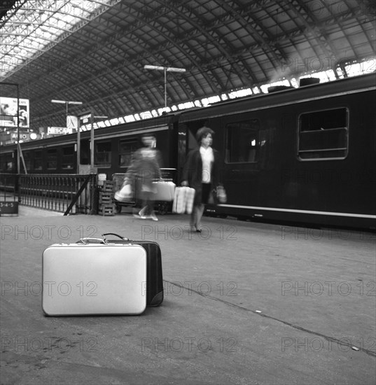 Travellers on a platform, Centraal Station, Amsterdam, Netherlands, 1963. Artist: Michael Walters