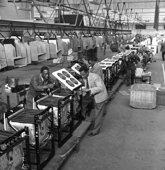 Immigrant workers on the cooker production line at the GEC, Swinton, South Yorkshire, 1962. Creator: Michael Walters.