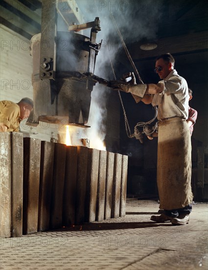 Teeming iron into ingots, J Beardshaw & Sons, Sheffield, South Yorkshire, 1963.  Artist: Michael Walters