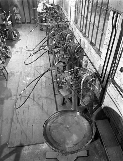 Continuous sharpening of longsaw blades, Slack Sellars & Co, Sheffield, South Yorkshire, 1963.  Artist: Michael Walters