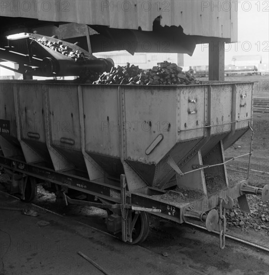 A rail truck being loaded with coal, Lynemouth Colliery, Northumberland, 1963. Artist: Michael Walters