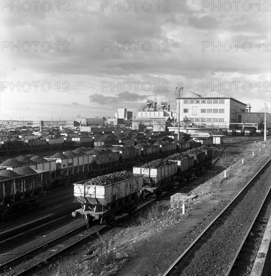 Rail trucks loaded with coal leaving Lynemouth Colliery, Northumberland, 1963.  Artist: Michael Walters