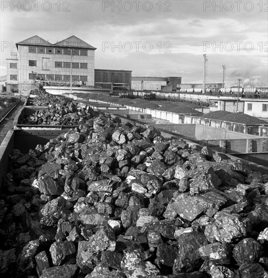 Rail trucks loaded with coal leaving Lynemouth Colliery, Northumberland, 1963.  Artist: Michael Walters