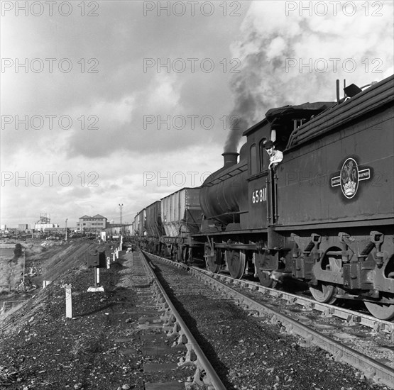 Steam loco no 65811 hauling coal from Lynemouth Colliery, Northumberland, 1963.  Artist: Michael Walters