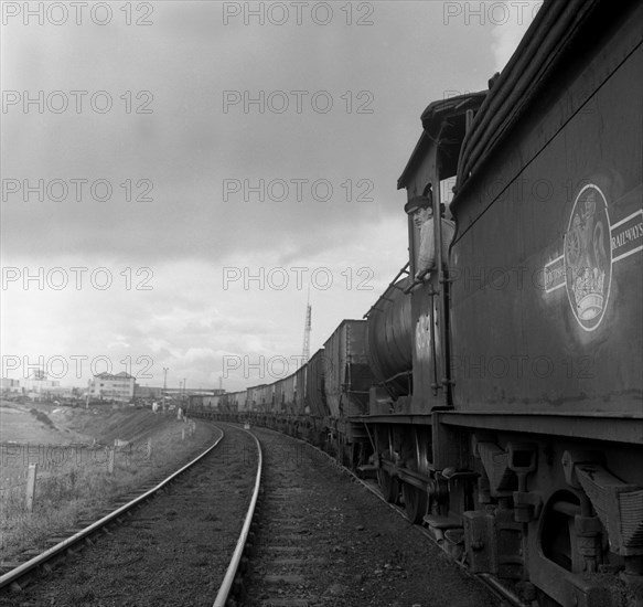 Steam loco no 65811 hauling coal from Lynemouth Colliery, Northumberland, 1963.  Artist: Michael Walters