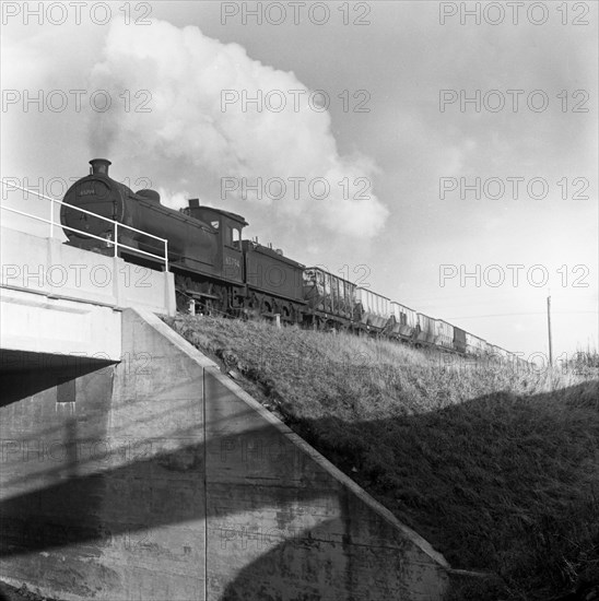 Steam loco no 65794 hauling coal from Lynemouth Colliery, Northumberland, 1963.  Artist: Michael Walters