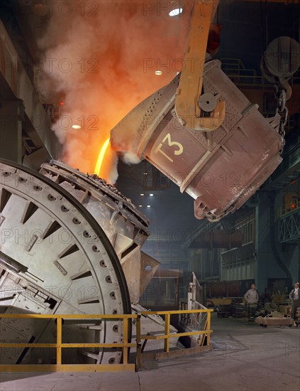 Pouring molten iron into a Kaldo unit, Park Gate Iron & Steel Co, Rotherham, South Yorkshire, 1964. Artist: Michael Walters