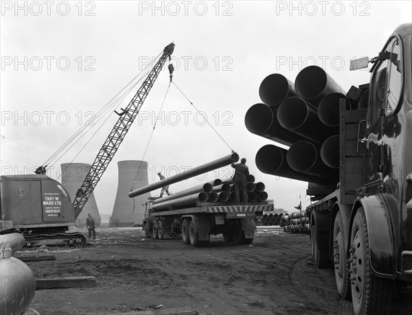 Pipe wrapping to prevent corrosion on steel pipes, Old Denaby, South Yorkshire, 1961. Artist: Michael Walters