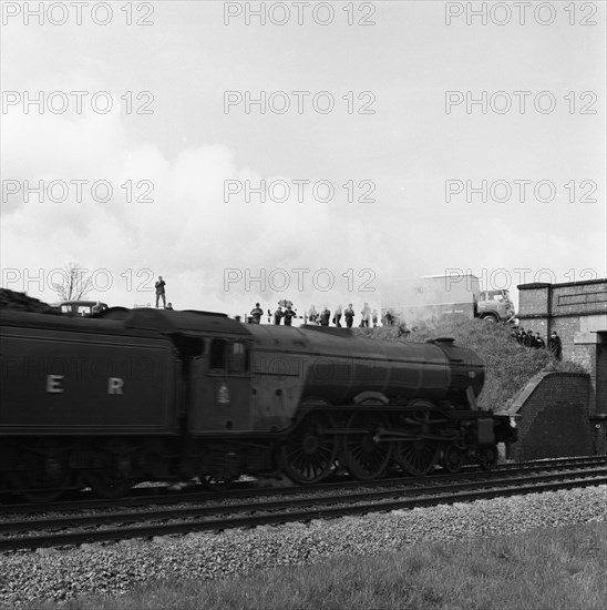 The 'Flying Scotsman' passing under a bridge at speed, near Selby, North Yorkshire, 1968. Artist: Michael Walters