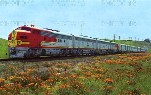 Santa Fe's 'Super Chief' passing a field of California poppies, 1956. Artist: Unknown