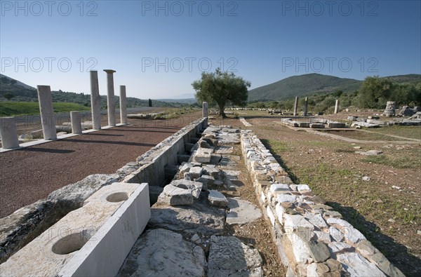 A latrine in Messene, Greece. Artist: Samuel Magal