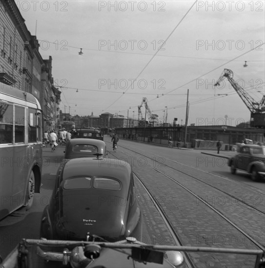 Heavy traffic outside the Royal Palace, Stockholm, Sweden, 1950. Artist: Torkel Lindeberg