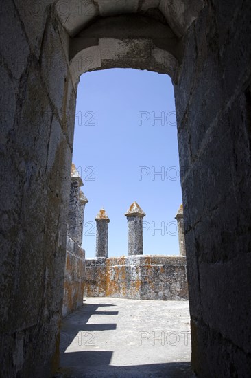 Merlons on the battlements seen through an arched doorway, Beja Castle, Beja, Portugal, 2009.  Artist: Samuel Magal