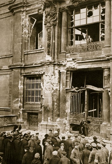 A crowd of men gathered in front of a ruined building, Germany c1918-c1919(?) (1936) Artist: Unknown