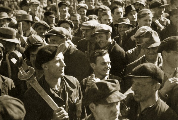 Factory workers with their tools celebrate the traditional Socialist holiday, Germany, 1936. Artist: Unknown