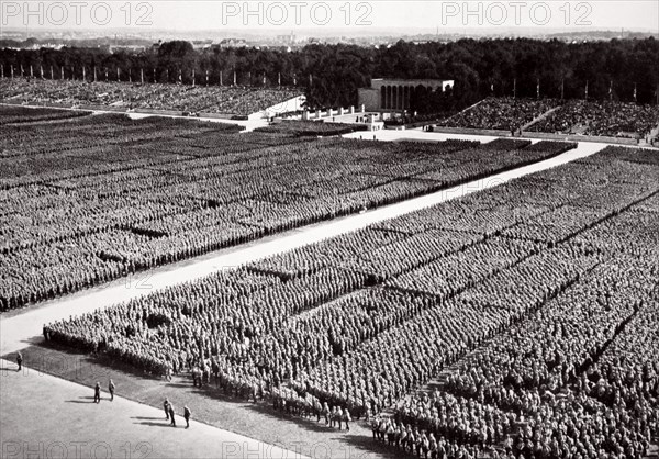 Stormtroopers lined up on parade during a Nazi Party Congress in Nuremberg, Germany, 1936. Artist: Unknown