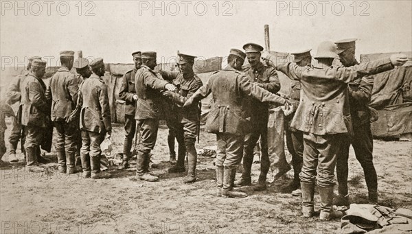 British soldiers searching captured German prisoners, Somme campaign, France, World War I, 1916. Artist: Unknown