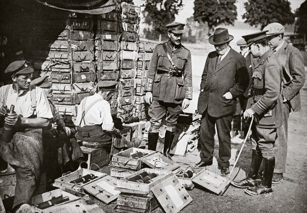 Mr Asquith watching men adjusting fuses, Somme campaign, France, World War I, 1916. Artist: Unknown