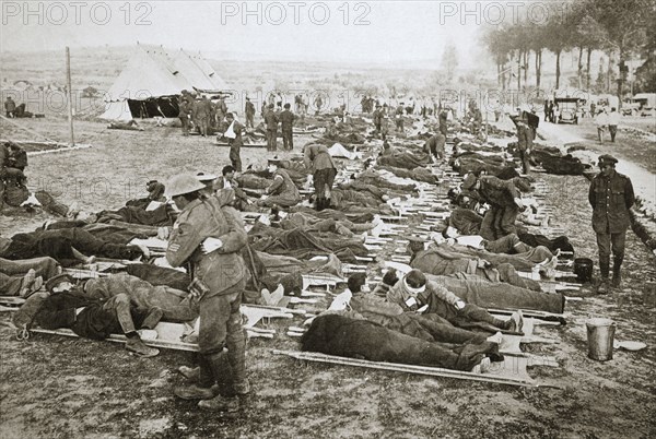 Wounded men waiting to be taken away to a clearing station, France, World War I, 1916. Artist: Unknown