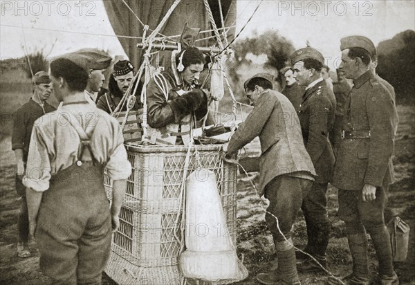 Observer of a kite-balloon testing the telephone before ascending, France, World War I,1916. Artist: Unknown