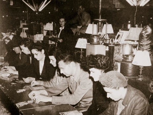 Automobile workers playing bingo at a carnival at Dearborn, Michigan, USA, c1938. Artist: Unknown