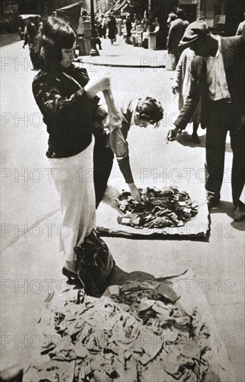 New York street trader selling stockings, USA, c1920s-c1930s. Artist: Unknown