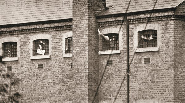 Hunger strikers waving to Christabel Pankhurst from their cells in Holloway Prison, London, 1909. Artist: Unknown