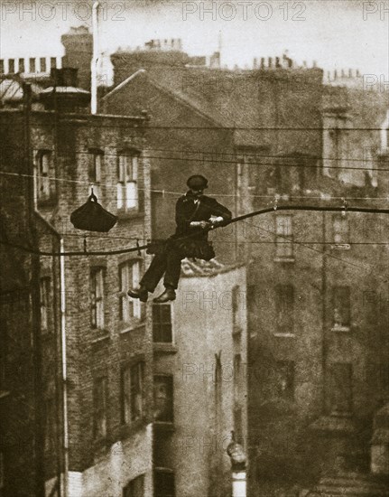 Inspecting a telephone cable between Conduit and Maddox Streets, 20th century. Artist: Unknown