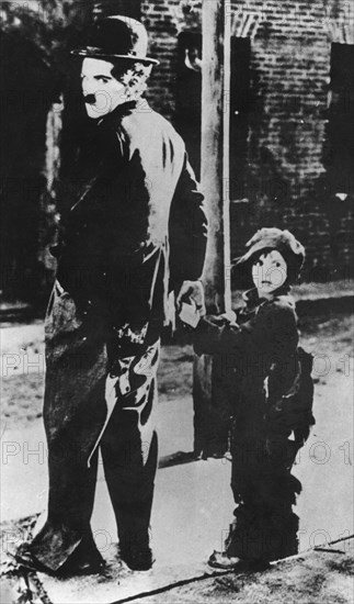 Charlie Chaplin and Jackie Coogan in 'The Kid', 1921. Artist: Unknown