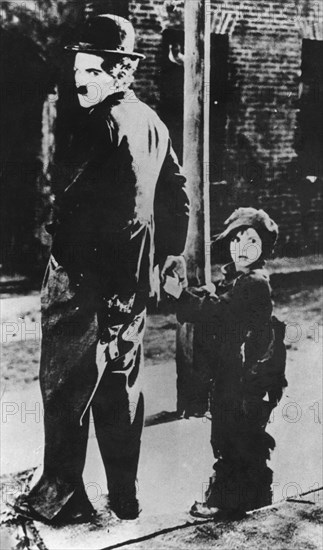 Charlie Chaplin and Jackie Coogan in 'The Kid', 1921. Artist: Unknown