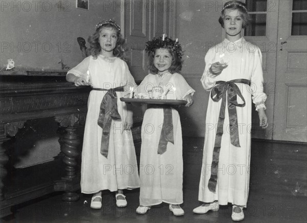 Princesses Birgitta, Desiree and Margaretha of Sweden, St Lucy's Day, 1943. Artist: Karl Sandels